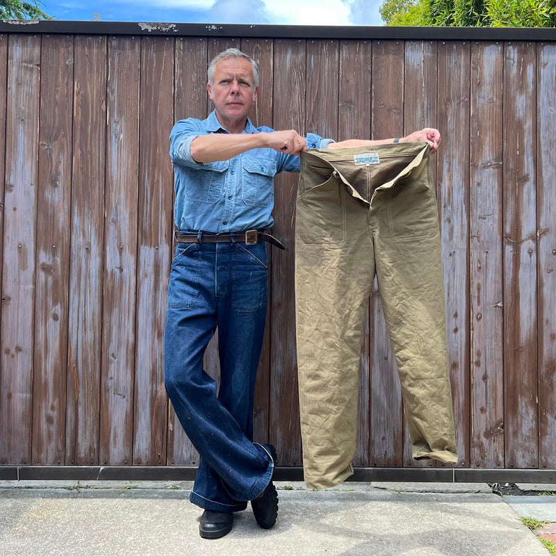 Fit image - Christophe Loiron wearing the Snow Denim Swabbies and holding the new Swabbies MOD (No Bell) Khaki HBT