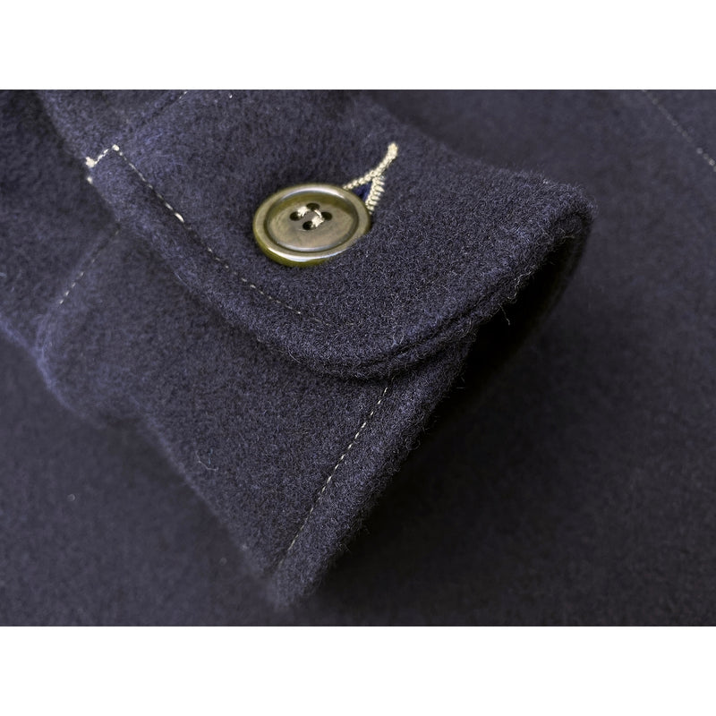 MF51 Field Shirt cuff with contrast stitch and olive green corozo wood button. 