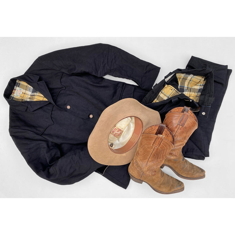 Pioneer Jacket and Deputy Pants in Midnight Denim with vintage western boots